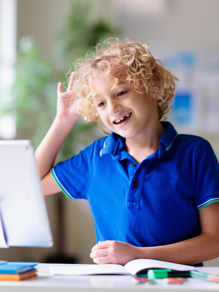 A boy learning online with a tablet on BrightBe One
